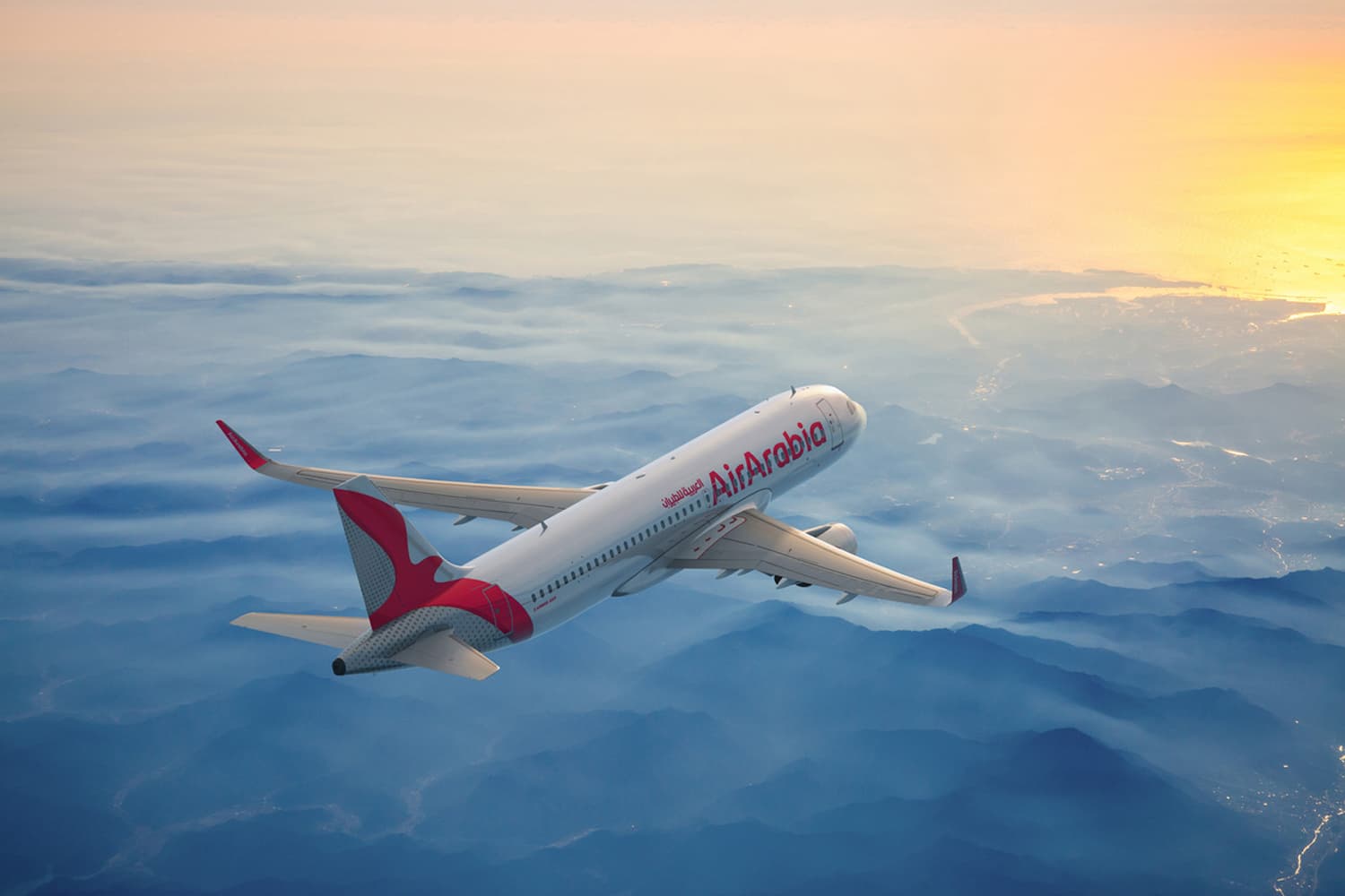 An Air Arabia Airbus A320 in flight above the clouds