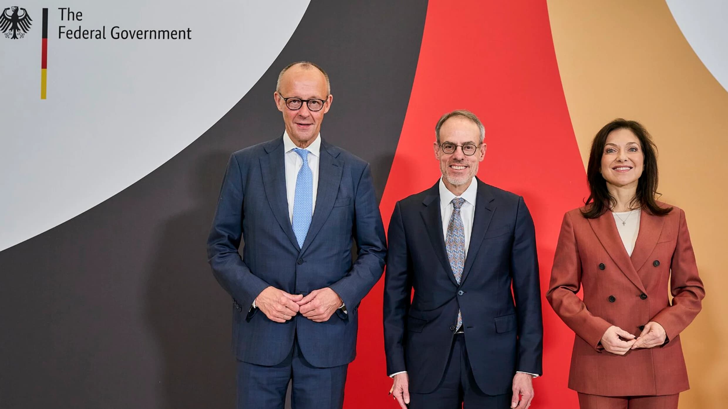 Amazon and German government representatives posing together at a joint announcement event