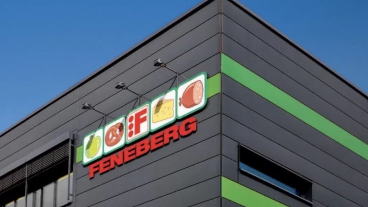 The Feneberg supermarket logo mounted on the corner of a dark modern store building