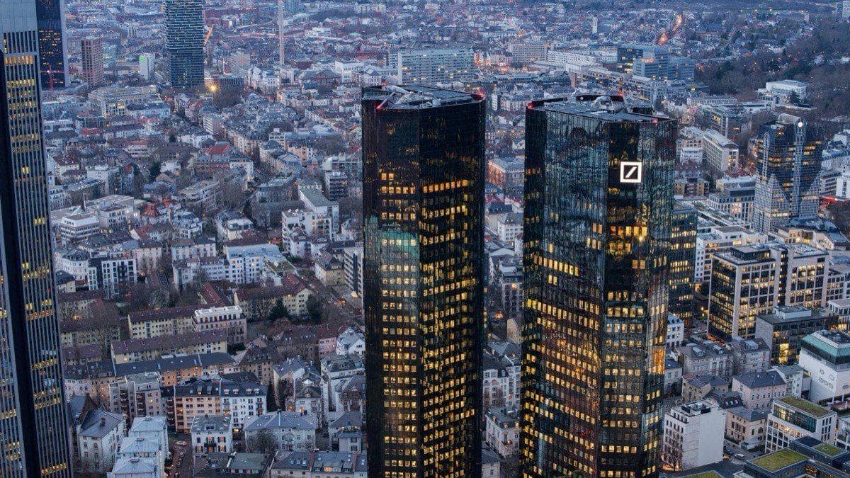 Aerial view of the Frankfurt skyline at dusk with the Deutsche Bank twin towers lit up