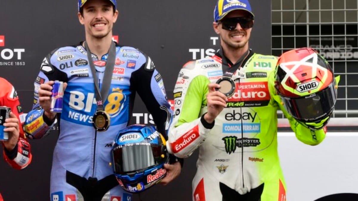 Two MotoGP riders celebrating with medals in parc ferme at the German Grand Prix