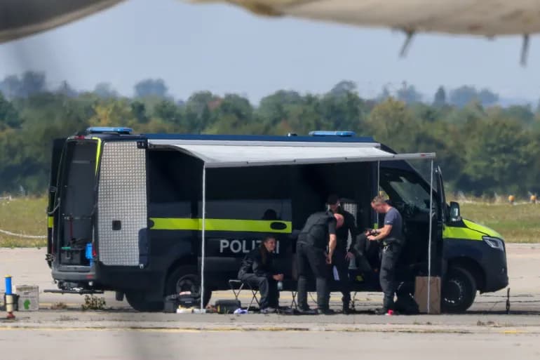 German police officers at a mobile command unit during a security operation