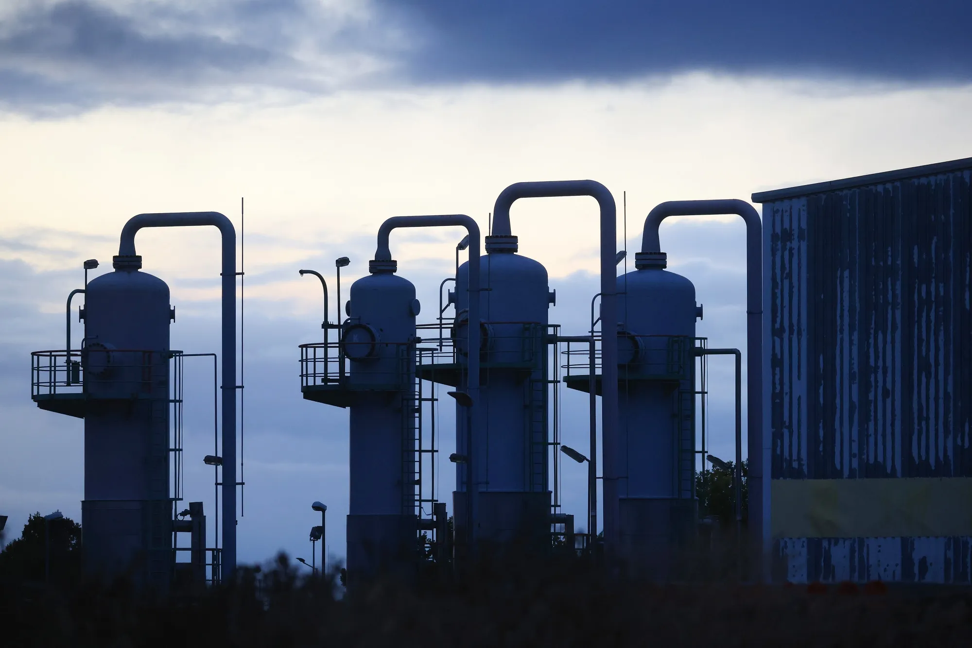 Gas storage infrastructure in Germany at dusk, as officials say refill targets for winter fell short of expectations