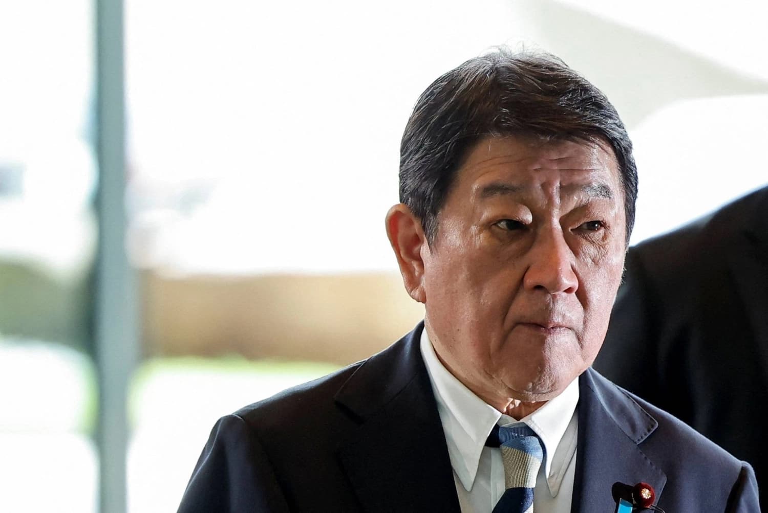 A Japanese government official pictured amid the signing of the Japan-Germany evacuation cooperation memorandum