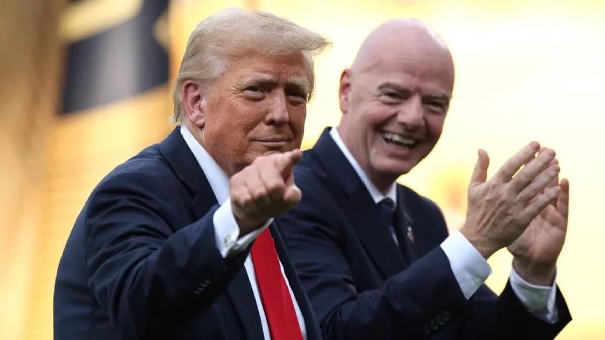 Donald Trump pointing and Gianni Infantino applauding together at a football stadium
