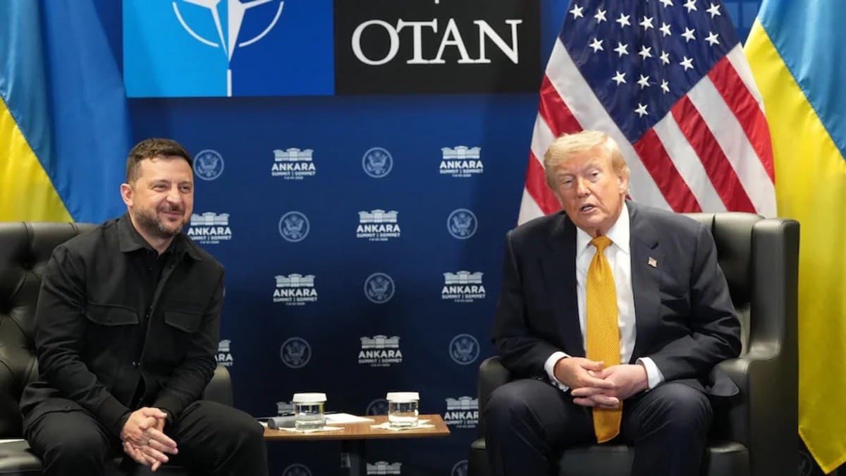 Volodymyr Zelensky and Donald Trump seated together in front of NATO, US and Ukrainian flags at the Ankara summit