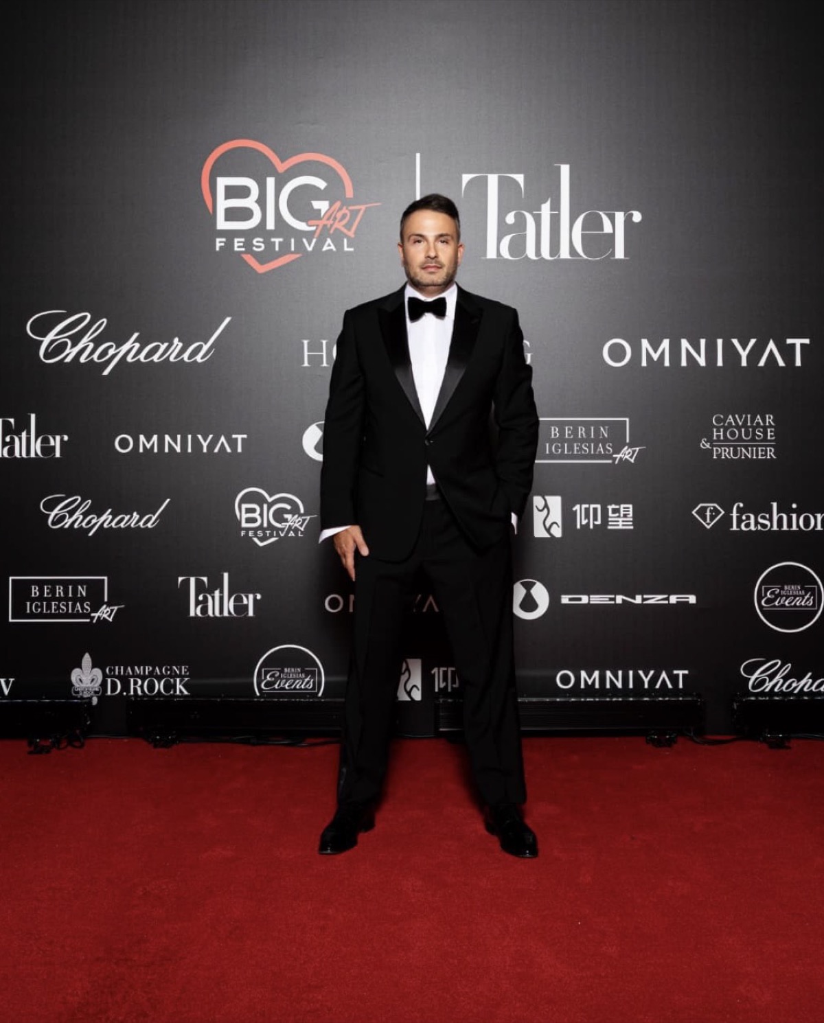 Maxim Berin in a black tuxedo on the Big Art Festival red carpet