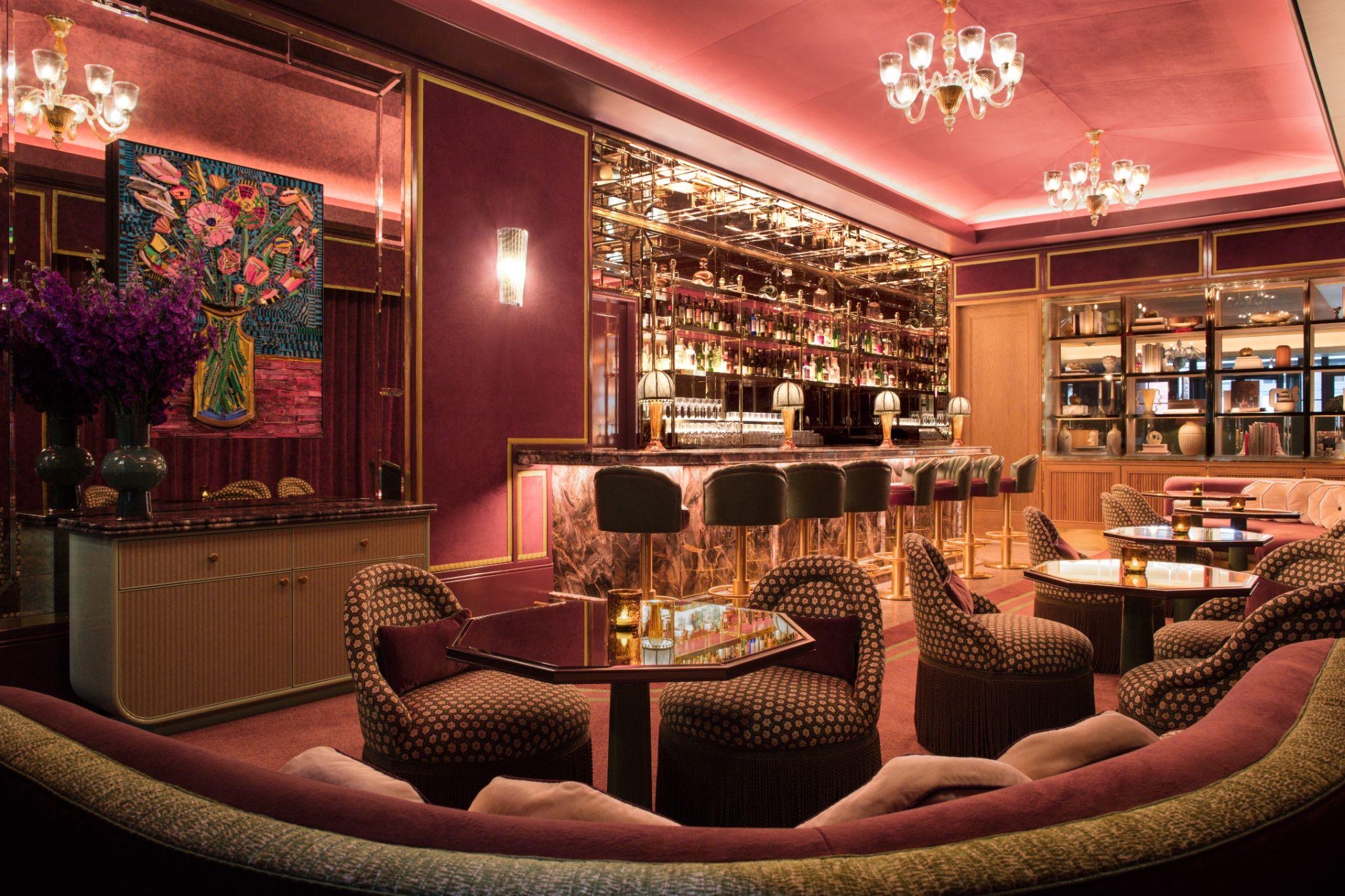 A contemporary floral painting on the wall of the Two E Lounge at The Pierre, beside the bar and seating